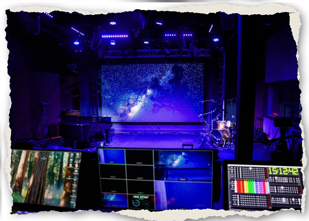 The Live Room's LED wall with the multicam monitoring and switcher screens in the foreground